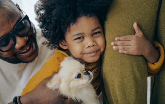 canva african american kid hugging dog and leg of parent MAEAwpSm7mc