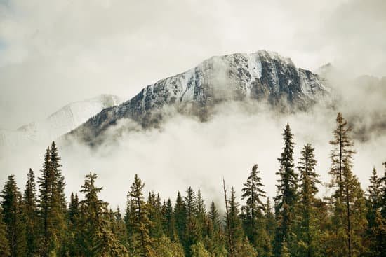 canva banff national park foggy mountains MACNSs7eak0