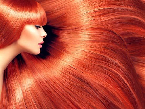 canva beautiful hair. beauty woman with long red hair as background MADBoslZNvs