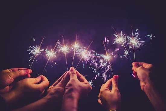 canva beautiful sparklers in people hands on black backgroundholiday and xmas and new year concept. MADZ 9AYfC0