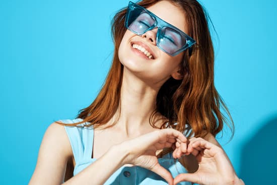 canva beautiful woman in fashionable glasses blue background lifestyle MAEo9gW2l3M