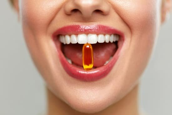 canva beautiful woman mouth with pill in teeth. girl taking vitamins MADauR2DGvQ