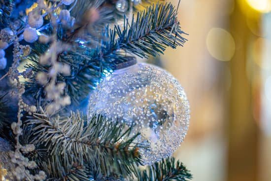 canva big blue glass ball on christmas tree MAEMAfMCti8