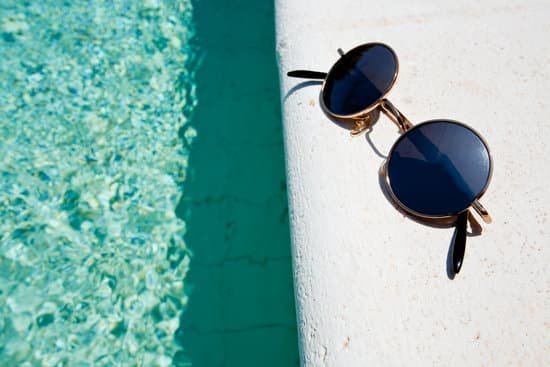 canva black round sun glasses on pool board MAC398bv3n8