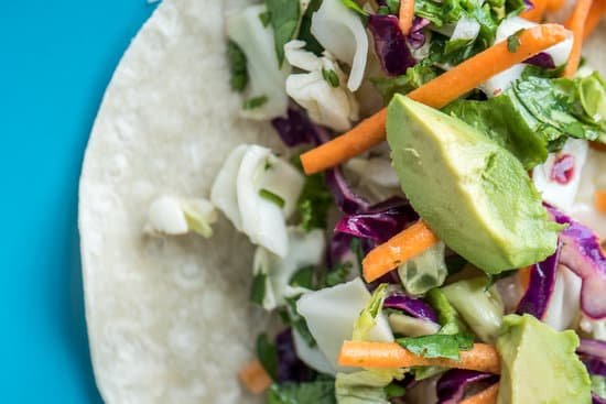 canva bright delicious vegetable vitamin salad on tortilla MAEFomSFrm8