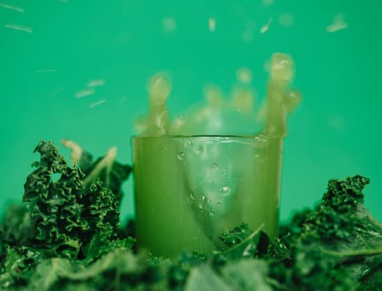canva bright vitamin juice near lettuce leaves on green background MAEDjrXYE7c