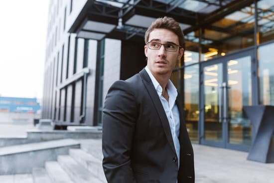 canva businessman with glasses outside the office MACJuyqstDo