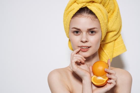 canva cheerful woman with bared shoulders oranges in the hands of citrus skin care vitamins health MAENbD4YSYM