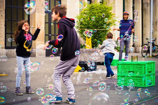canva children playing with bubbles in the street