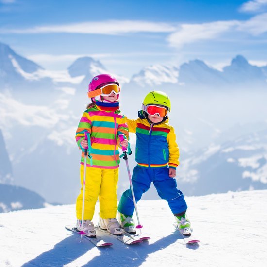 canva children skiing in the snow mountains MADFD6obl9E