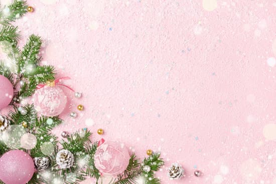 canva christmas frame of new year ornaments and snow on pink background. MADerOkkAnI