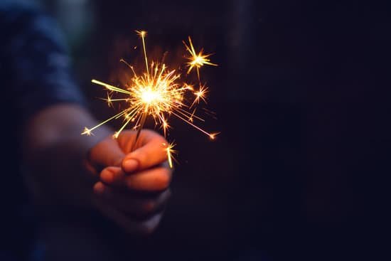 canva christmas new year sparkler in woman hands. MADaABMDuow