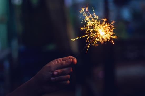canva christmas new year sparkler in woman hands. MADaE0N5yy8