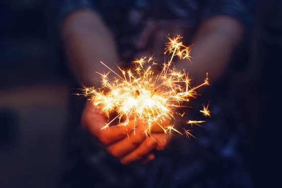 canva christmas new year sparkler in woman hands.