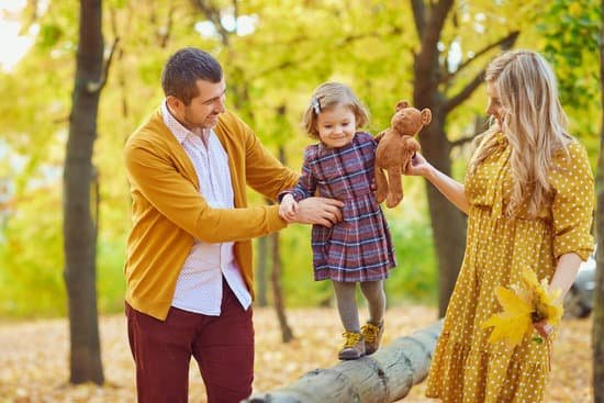 canva content girl with parents walking in autumn park MAEJoJfgJWI