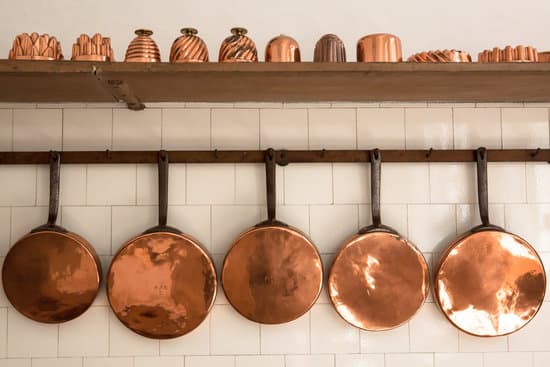 canva copper pans in the kitchen MADQ5lcbNgU