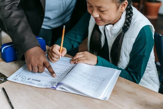 canva crop ethnic schoolgirl with teacher during class MAENv4DU7DY