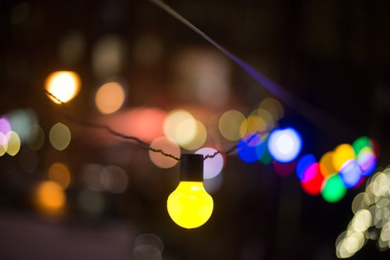 canva defocused image of illuminated lights at night