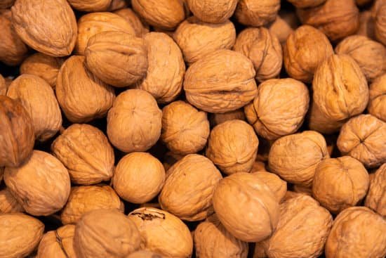 canva delicious walnuts in shells healthy fats vitamins. may be used as abstract background. MADqVyeuV8A