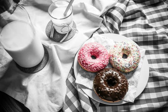 canva donuts and milk on the table MADQ474wBIA