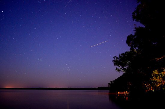 canva falling star time lapse during night