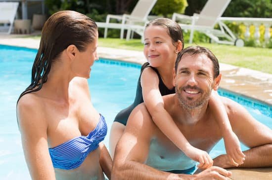 canva family enjoying in pool MADariKBEbI