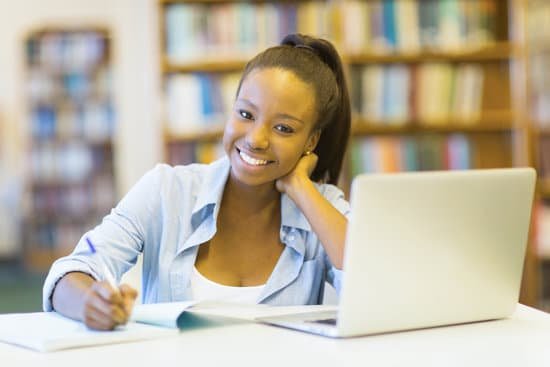 canva female african college student using laptop MADaq wDaEQ