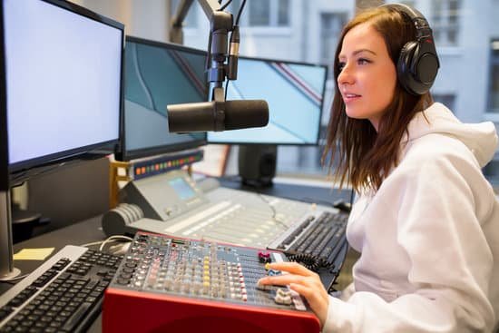 canva female host using control panel at radio station MADatIUKC9g