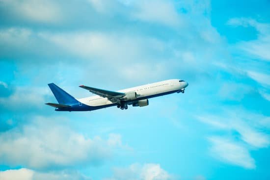canva flying plane on blue sky background MAEE2FjbNrc