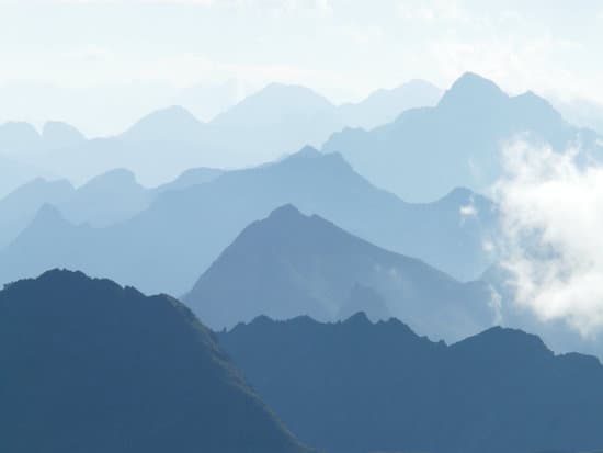 canva foggy mountain landscape MAEFeGiHOQs