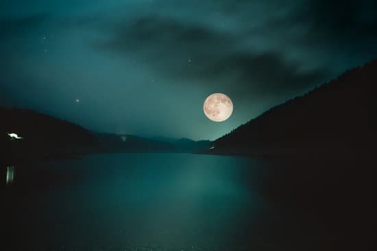canva full moon over the mountain lake. halloween concept MADapalgBwQ