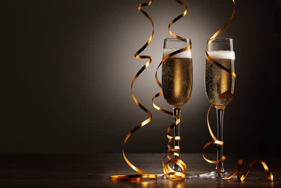 canva glasses of champagne at new year party MACf1AuRB5A