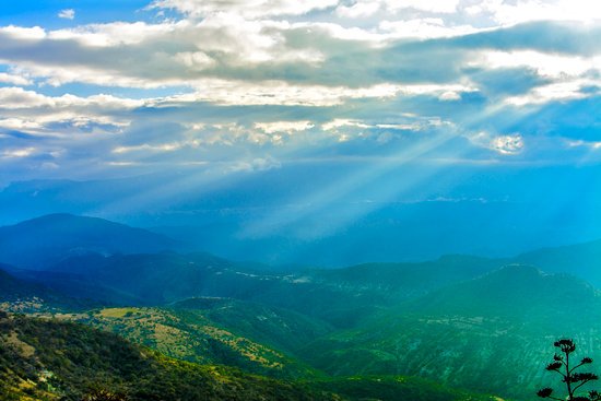 canva green mountains under blue sky