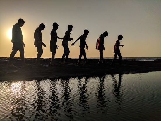 canva group of children walking near body of water silhouette photography MADGyblrK0I