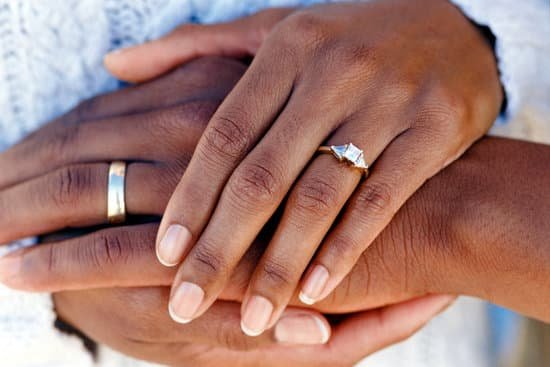 canva hands of married couple wearing wedding rings MADatPq9ag8
