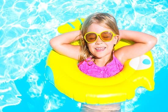 canva happy child in swimming pool. summer vacation MADas3QPD4s