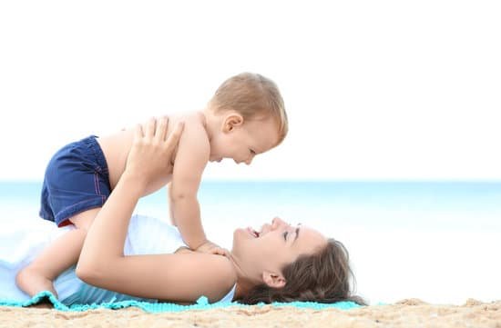 canva happy mother with little son on beach MAD9UKD6YHw