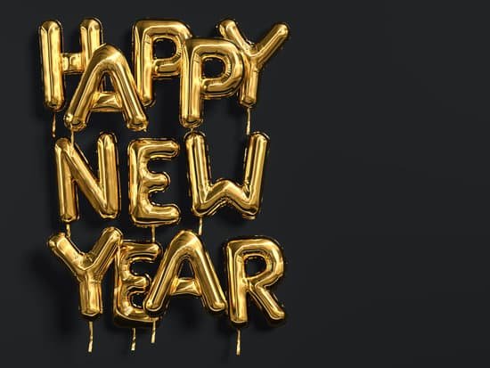 canva happy new year gold text on black background golden foil balloon typography MADerJctZUs