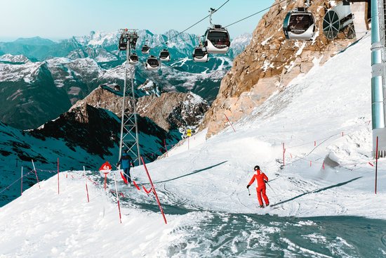 canva high angle view of people skiing on snowcapped mountain