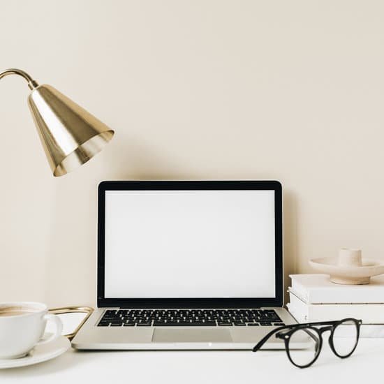 canva laptop on office desk MAD2CWO OLM