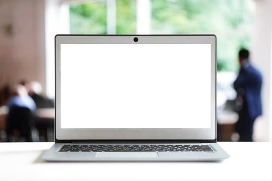 canva laptop with blank screen in office MADesXVgNs4