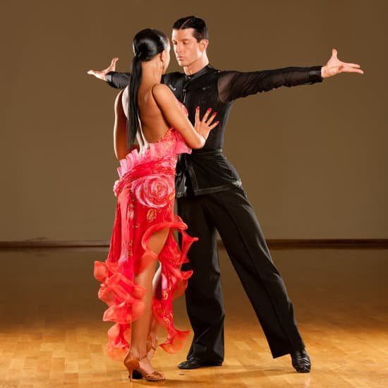 canva latino dance couple dancing in ballroom MAC9b0dLBEY