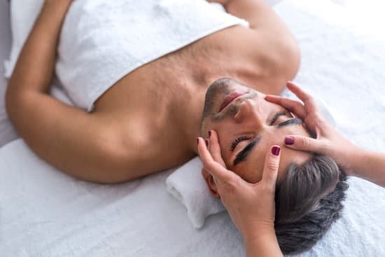 canva male beauty man receiving facial massage at luxury spa MADerOnUfQ8
