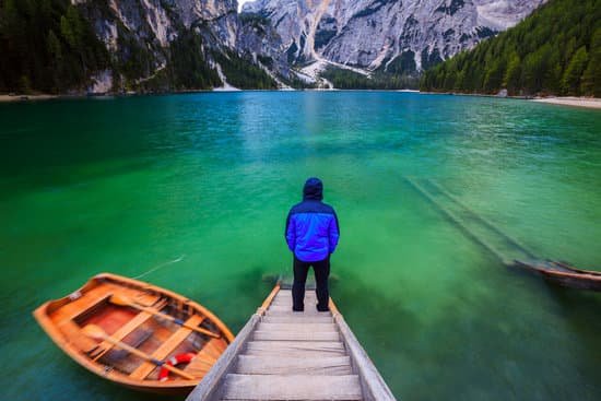 canva man alone at the braies lake italy MAD6u7bz7OM