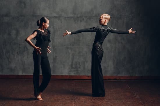 canva man and woman in black outfit in ballroom dance pose MAEJYmdcyls