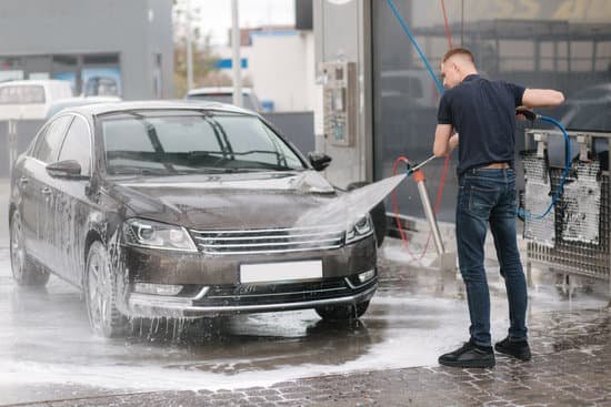 canva man cleaning car with pressure washer MAELP8cnybg