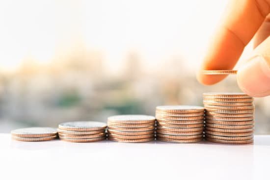 canva mans hand put money coins to stack of coins. money financial business growth concept. MADaAh6R5Pk