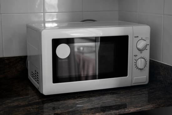 canva microwave in a kitchen for cooking or heating a dish. MADw3K6ib g