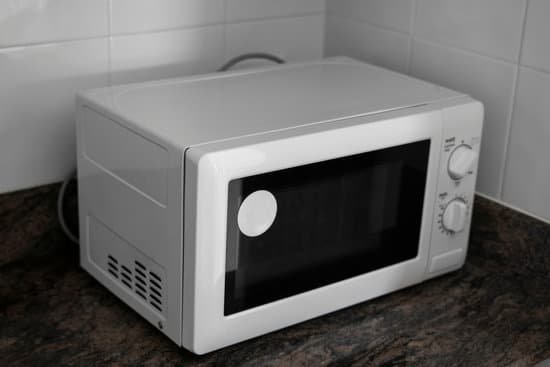 canva microwave in a kitchen for cooking or heating a dish. MADw3belnZU
