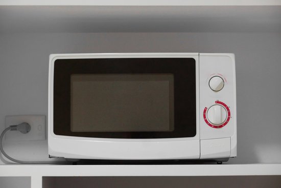 canva microwave oven in a cupboard MADJnVtgC5M